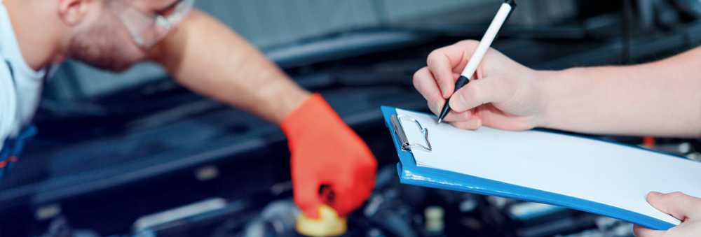 A Technician from Norwood Green about to perform an MOT Southall