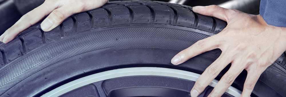 A Technician Fitting New Tyres Southall